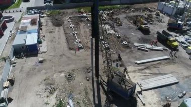 Construction site with a bird's eye in a megacity. New house in a new residential complex. Flying over the construction site. aerial panoramic top view from hight copter drone flying sky footage