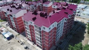 Construction site with a bird's eye in a megacity. New house in a new residential complex. Flying over the construction site. aerial panoramic top view from hight copter drone flying sky footage