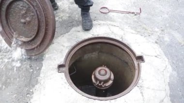 Fire hydrant ready to connect hose during fire fighting outdoors. Old red fire hydrant