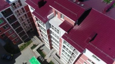 Construction site with a bird's eye in a megacity. New house in a new residential complex. Flying over the construction site. aerial panoramic top view from hight copter drone flying sky footage