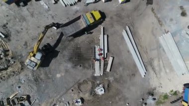 Construction site with a bird's eye in a megacity. New house in a new residential complex. Flying over the construction site. aerial panoramic top view from hight copter drone flying sky footage