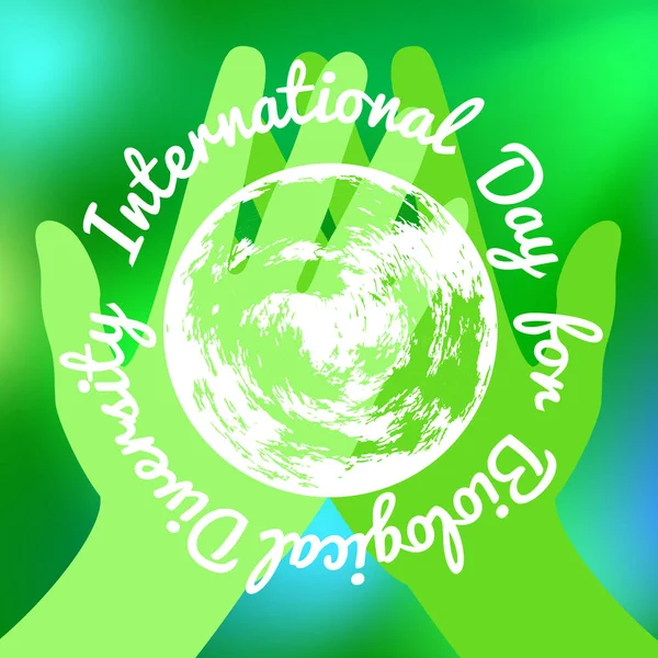 Journée internationale de la diversité biologique. Les mains vertes tenant une Terre. Sur un fond vert flou — Image vectorielle