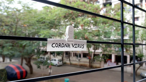 Stay home and stay safe, and quarantine sign on a window of building as a referral to the Corona virus or covid 19 pandemic in the India.