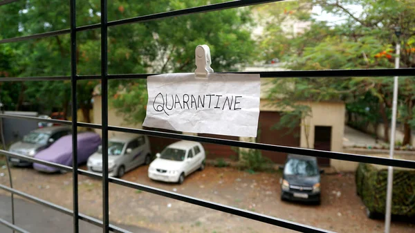 Stay home and stay safe, and quarantine sign on a window of building as a referral to the Coronavirus or covid 19 pandemic in the India.