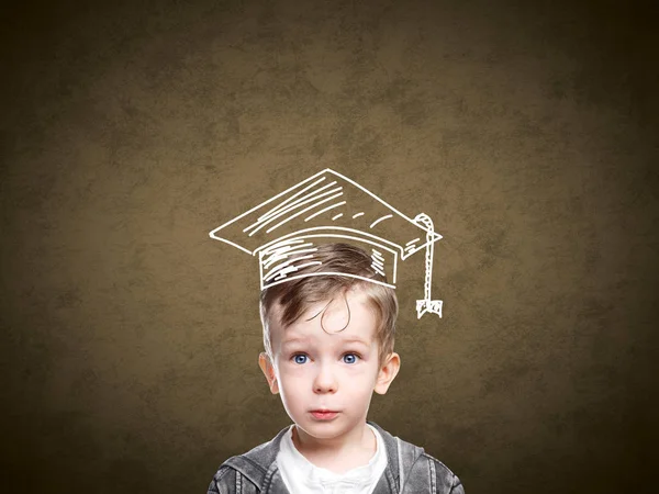 Smart child in a drawn student hat