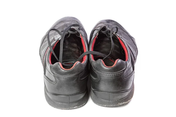 Alte Schuhe mit Schnürsenkeln auf weißem Hintergrund — Stockfoto