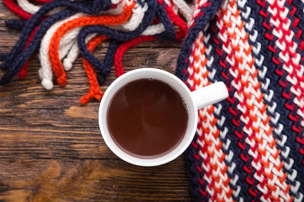 cocoa in a cup on a wooden background