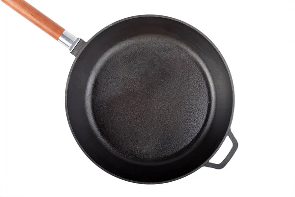 A cast-iron frying pan isolated — Stock Photo, Image