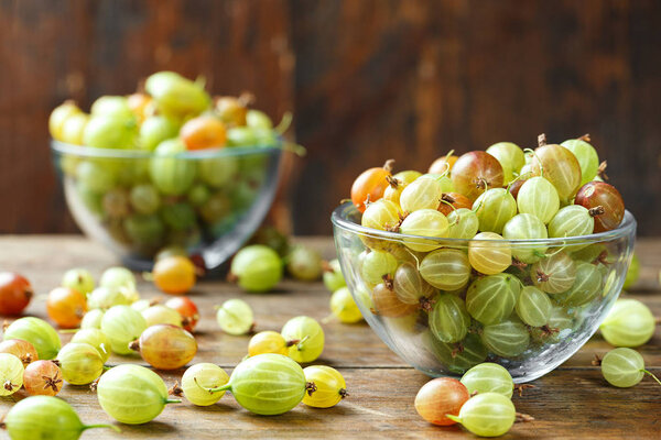 Ripe gooseberry in a plate on a table
