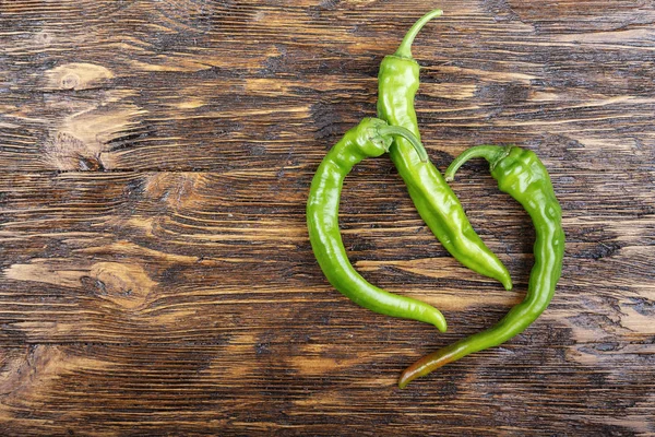 Green pepper on wooden surface. — Stock Photo, Image