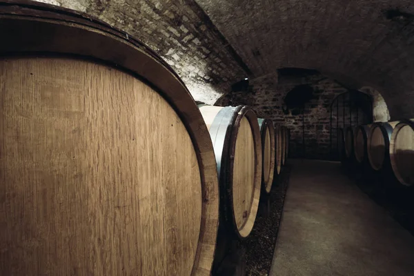 Barrels in a wine cellar close-up — Stock Photo, Image