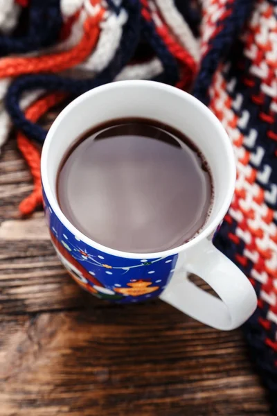 cocoa in a cup on a wooden background