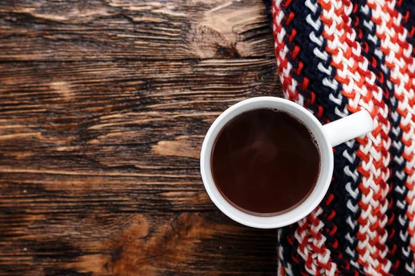 cocoa in a cup on a wooden background