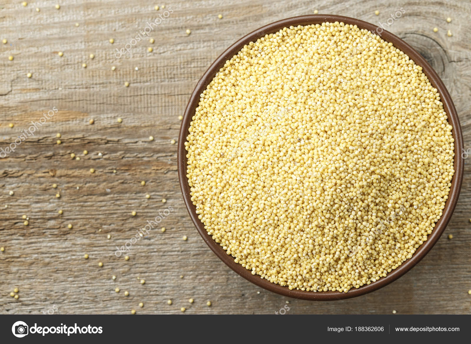 Millet cereal in a clay dish Stock Photo by ©Alexshyripa 188362606