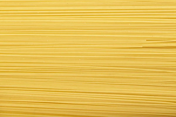 Arkaplan olarak çiğ spagetti — Stok fotoğraf