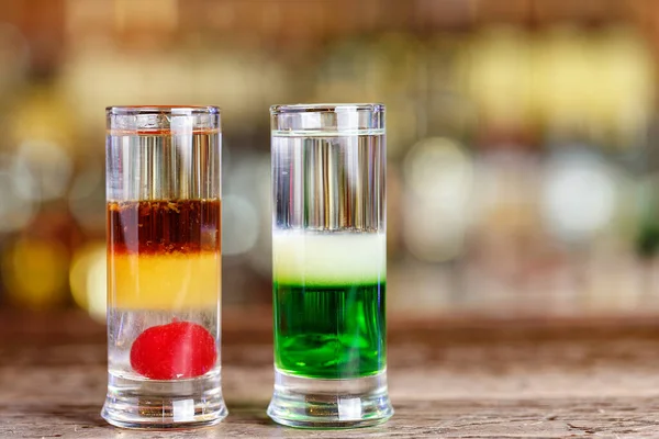 Different cocktails on the bar in a restaurant or in a pub, multilayered alcoholic drink