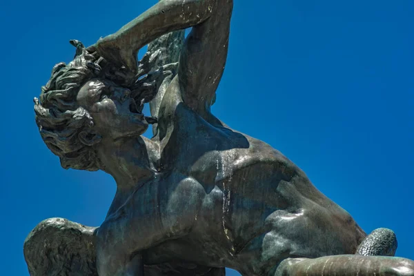 Fountain of the fallen angel. Angel caido in El Retiro park, Madrid, Spain.