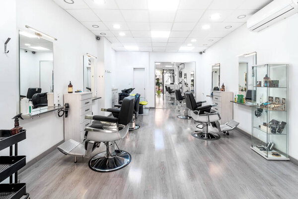 Modern bright hair and beauty salon. Barber salon interior business with black and white luxury decor.