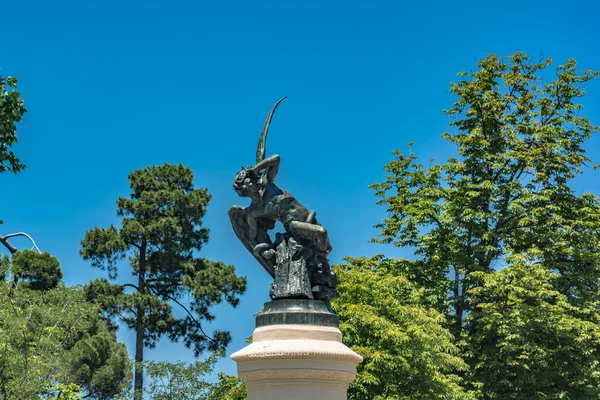 Fountain of the fallen angel. Angel caido in El Retiro park, Madrid, Spain.