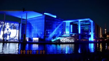Berlin, Germany. Circa August 2016. People watching the light and film show in Marie-Elisabeth-Luders-Haus at night.