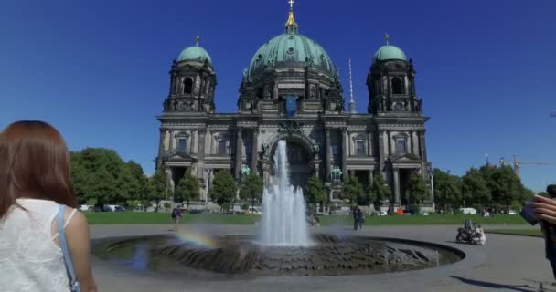 Couple visiting Berlin cathedral on a sunny day. Slow motion.