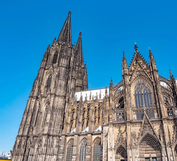 Gothic Cathedral Church of Saint Peter in Cologne, Germany on a sunny day. Beautiful cityscape with details of the towers, arches and windows stained glass