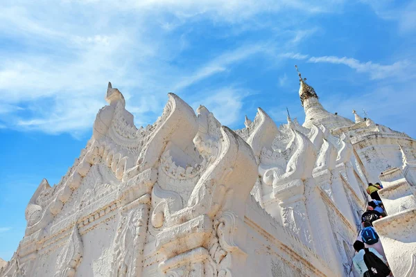 Hsinbyume Pagoda, known also as Myatheindan Pagoda in Mingun Mandalay, against a clear sky, covered by white clouds.