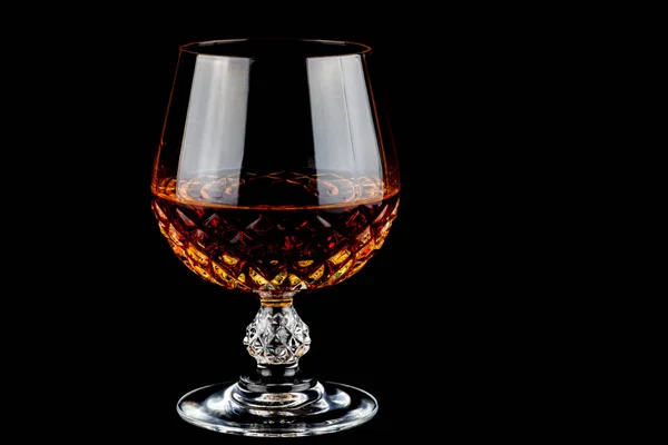 Brandy in a Crystal Glass on a Black Background — Stock Photo, Image