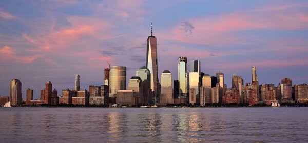 The World Trade Center, World Financial Center, and the skyline of downtown Manhattan from Jersey City at sunset.