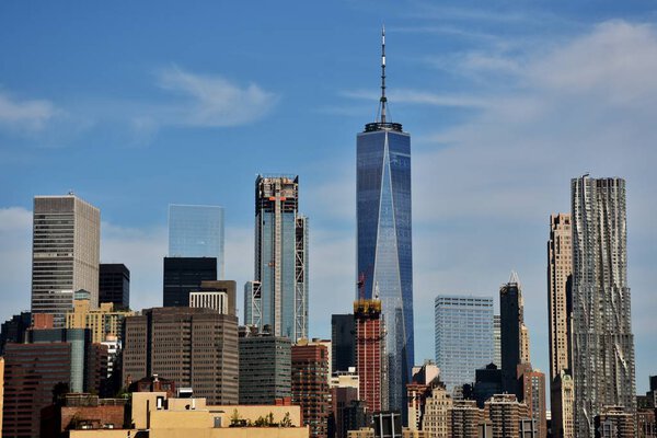 The Freedom Tower, Wall Street, and the skyline of downtown Manhattan from New York Harbor.
