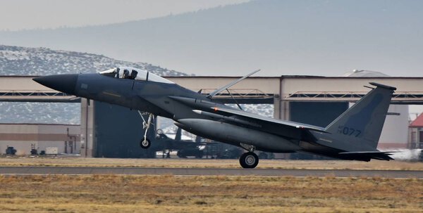 Klamath, Oregon, USA - 15 December 2017: An Air Force F-15C Eagle fighter jet on a runway at Kingsley Field. This F-15 belongs to the Oregon Air National Guard.