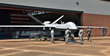 Columbus AFB, Mississippi - April 20, 2018: An Air Force MQ-9 Reaper drone undergoing maintenance in a hangar at Columbus Air Force Base, MS. clipart