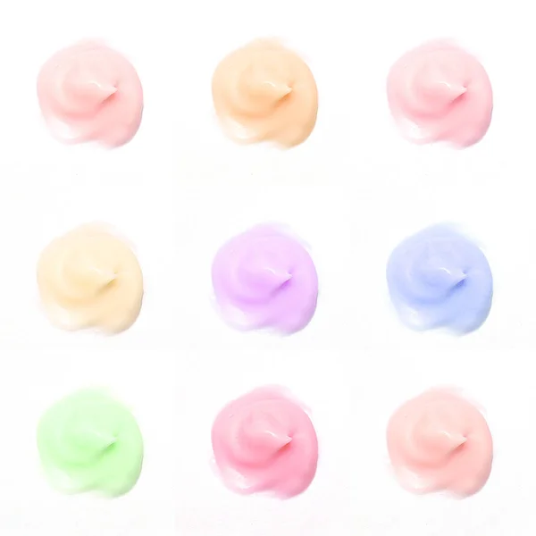Isolated samples of colored beauty cream on on white background — Stock Photo, Image