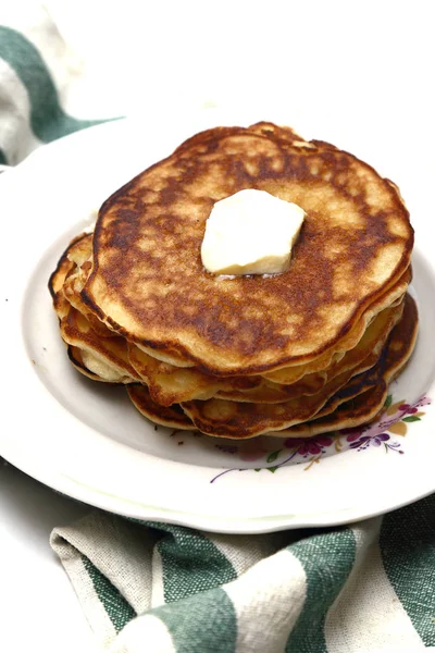Pancakes on Shrove Tuesday with a slice of butter — Stock Photo, Image