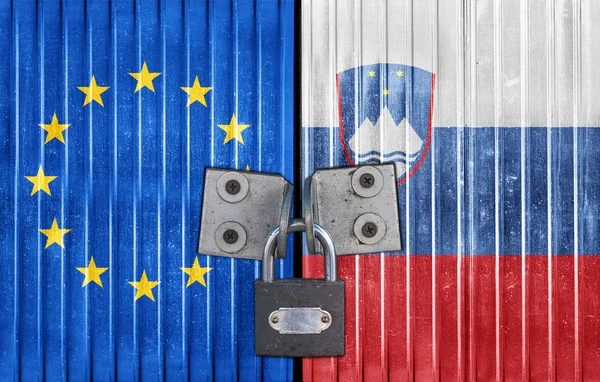 EU and Slovenia flag on door with padlock