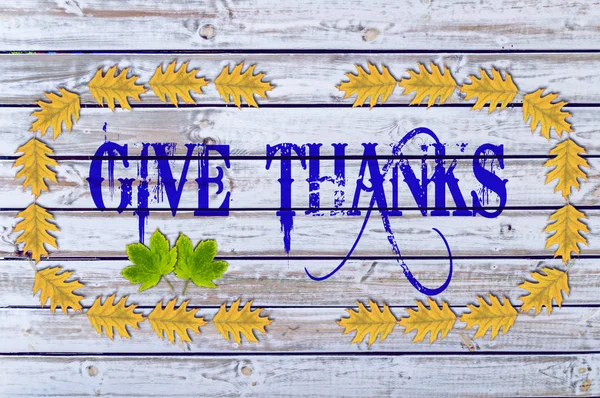 Give Thanks on wood with yellow leaves — Stock Photo, Image