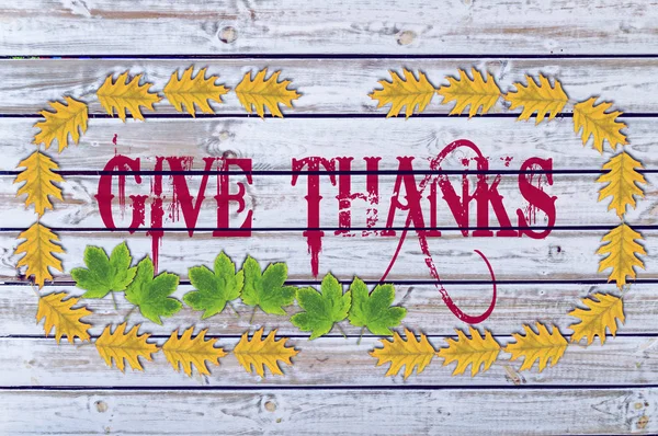 Give Thanks on wood with yellow leaves — Stock Photo, Image