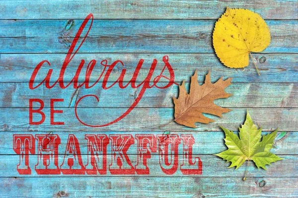 Always be thankful on blue wooden background — Stock Photo, Image