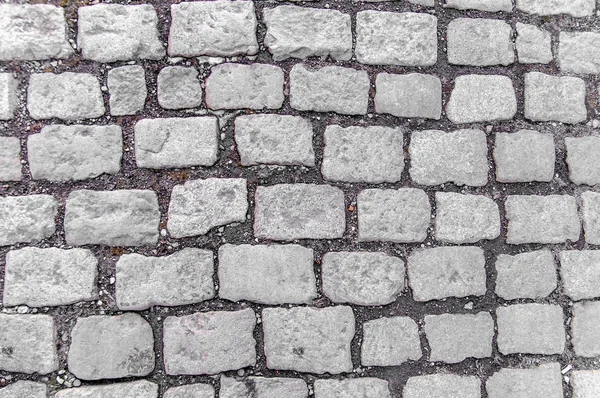 Abstrakt bakgrund av gamla kullersten trottoar — Stockfoto