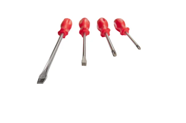 Four red shiny metal and plastic tool screwdriver for repair — Stock Photo, Image