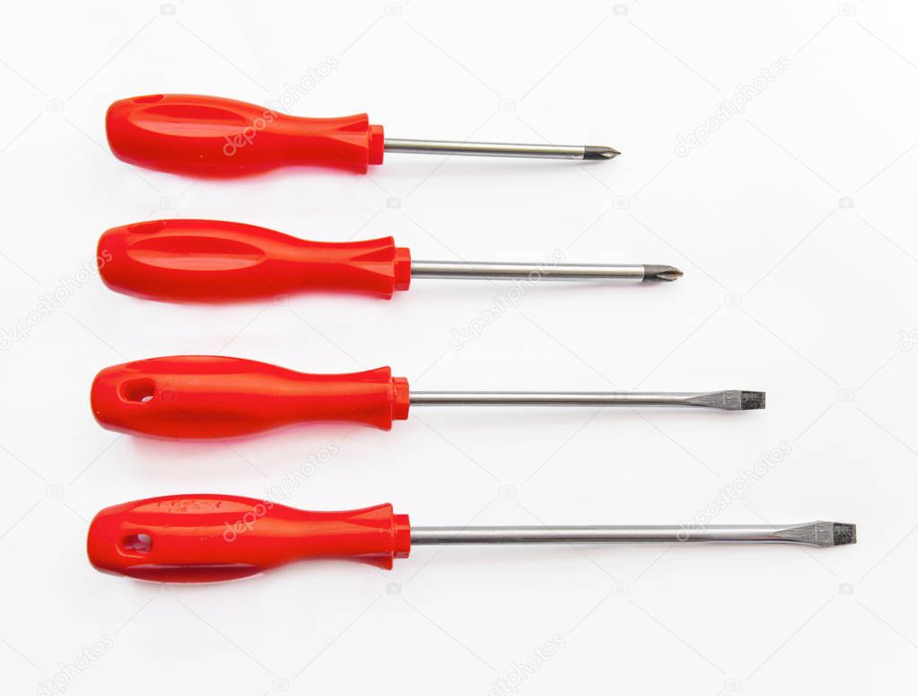 Four red shiny metal and plastic tool screwdriver for repair