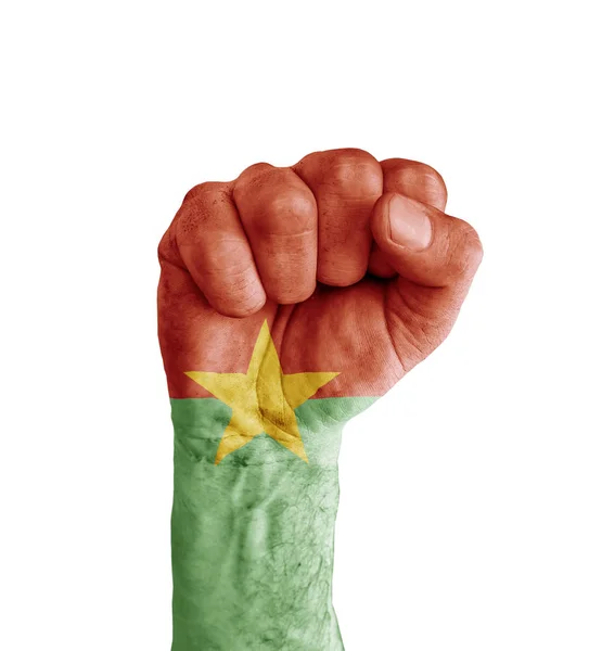 Flagge der Burkina Faso wie Siegessymbol auf Menschenfaust gemalt — Stockfoto