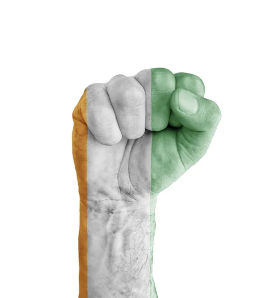 科特迪瓦国旗画在人类的拳头像胜利标志 — 图库照片
