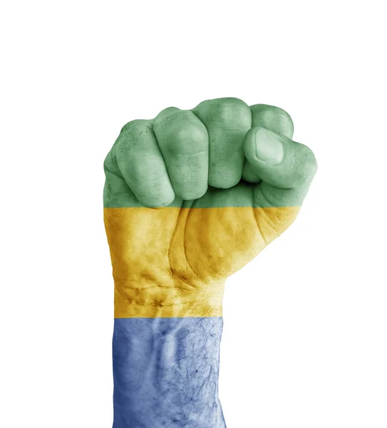 Bandeira do Gabão pintada no punho humano como símbolo de vitória — Fotografia de Stock