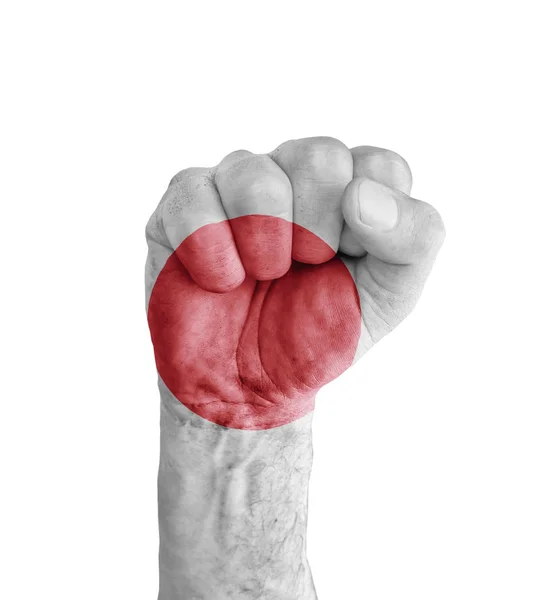日本国旗画在人类的拳头像胜利标志 — 图库照片