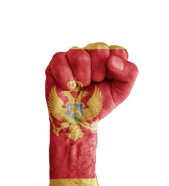 Montenegro flagga målad på mänskliga näven som seger symbol — Stockfoto