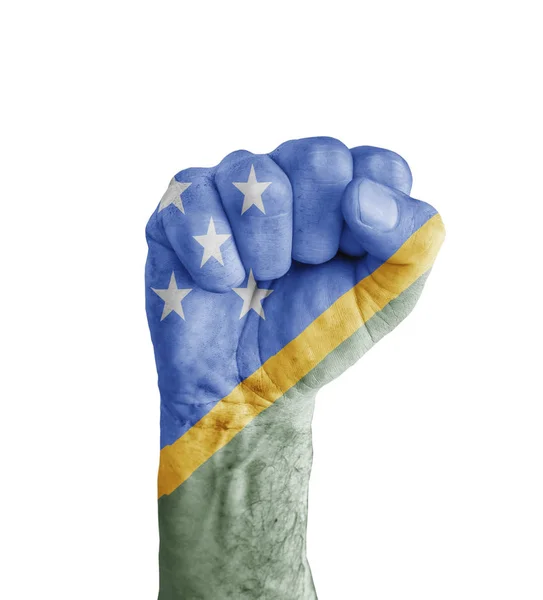Vlajka Šalamounových ostrovů namalované na lidské pěsti jako symbol vítězství — Stock fotografie