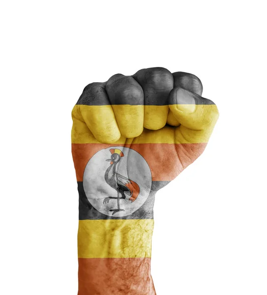 Bandera de Uganda pintada en puño humano como símbolo de victoria — Foto de Stock