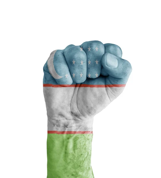 Прапор Узбекистану намальовані на людський кулак як символ перемоги — стокове фото