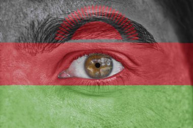 İnsan yüz ve göz Malavi bayrağı ile boyalı
